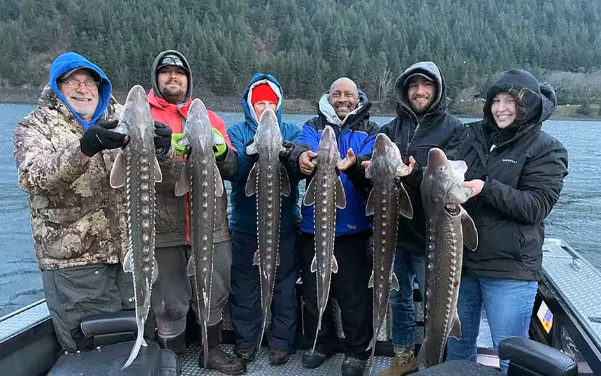 sturgeon-keepers-2024 six person holding sturgeon