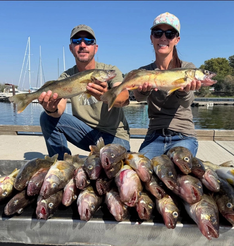 Anglers holding freshly caught walleye during a Walleye Fishing Guide Columbia River trip